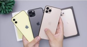 Hand holding multiple different iPhones. These are an example of phones you could purchase refurbished.