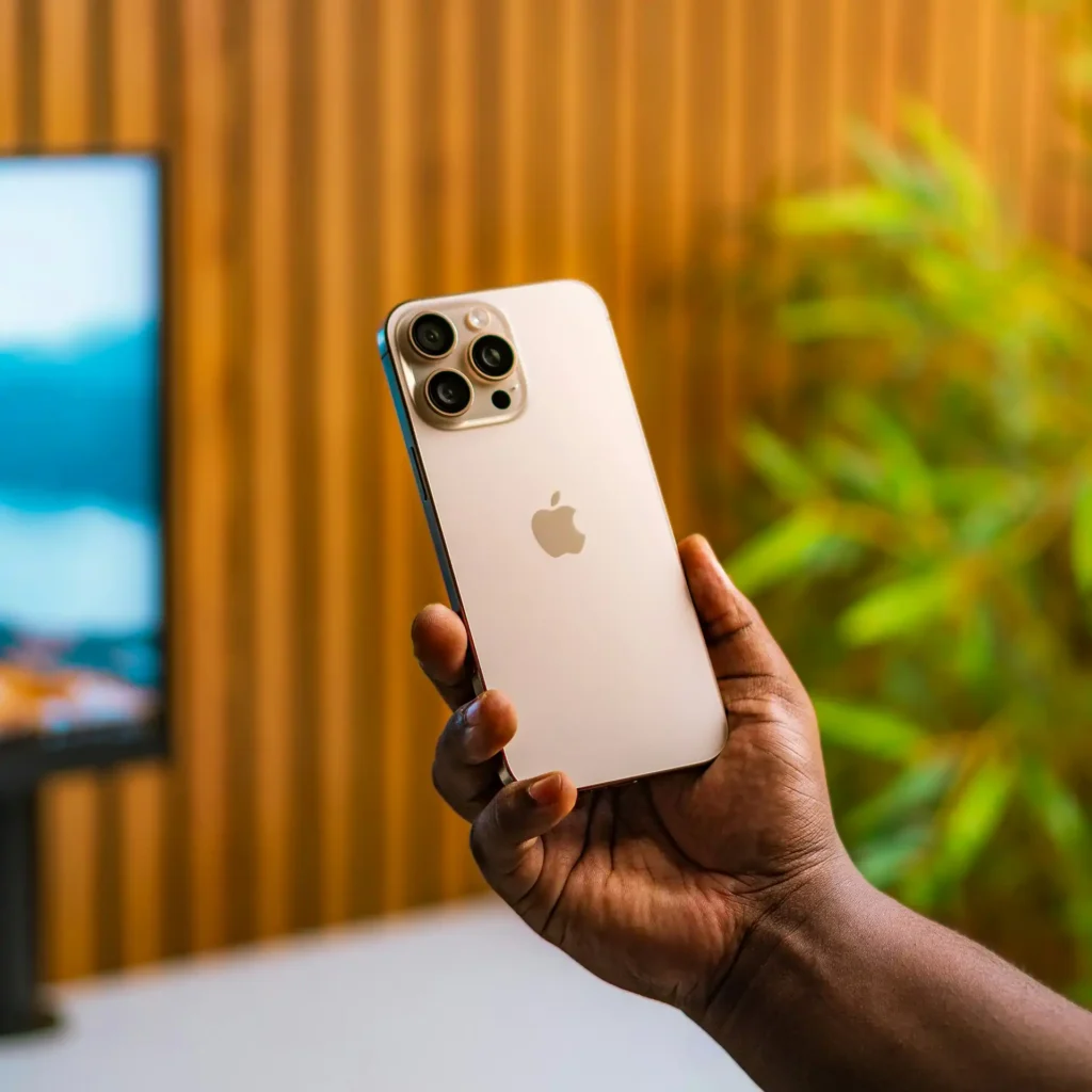 Holding iPhone 16 Pro Max 